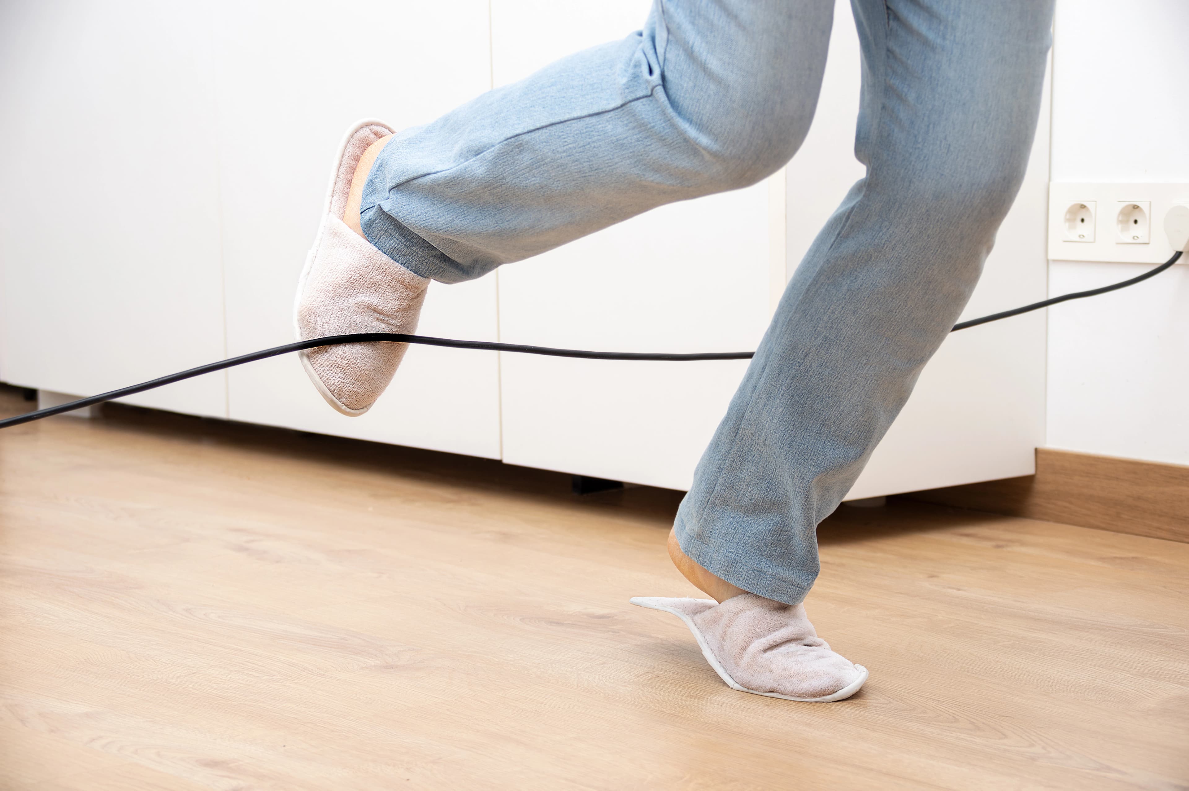 picture of woman tripping over a cable