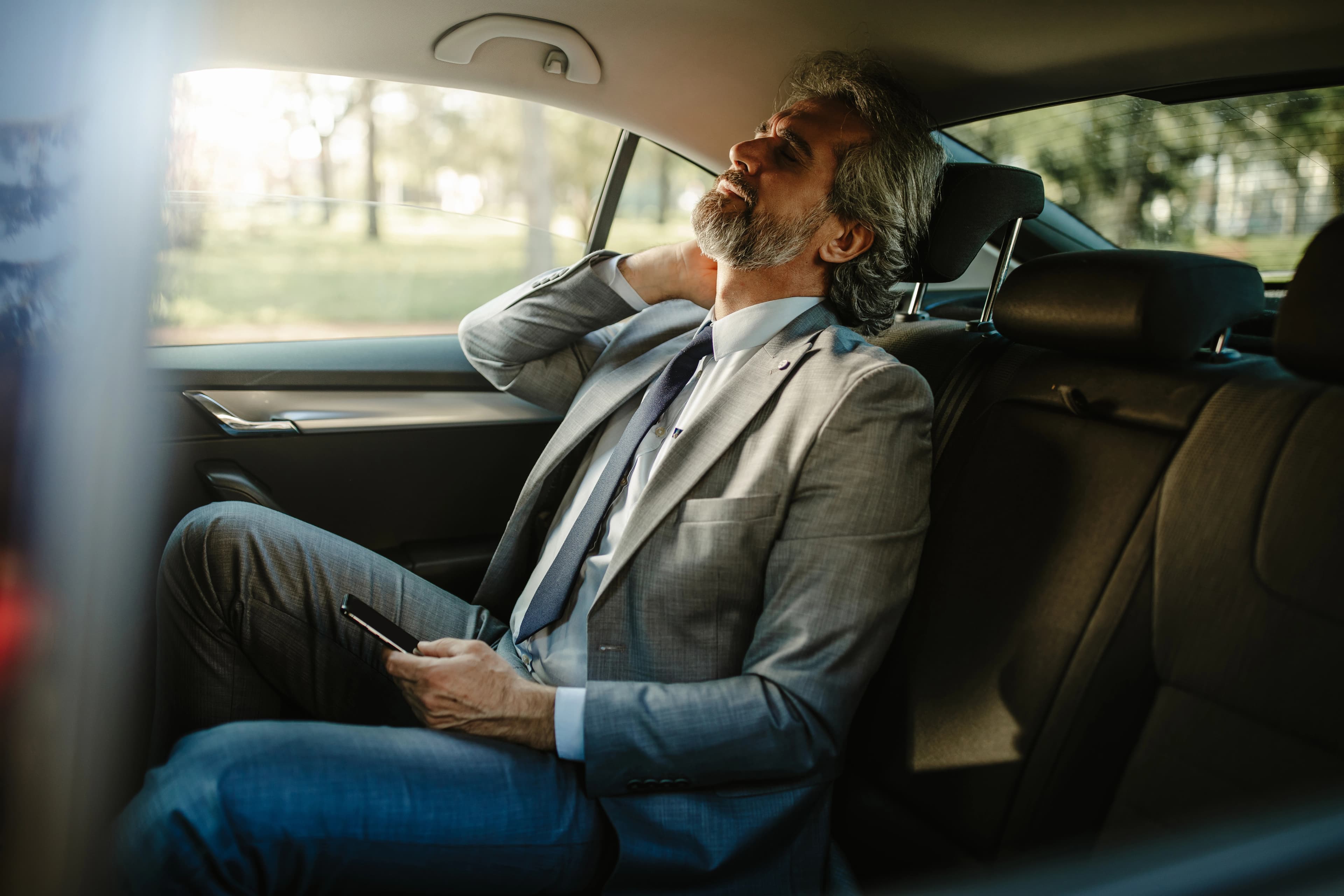 man with a tired neck due to whiplash